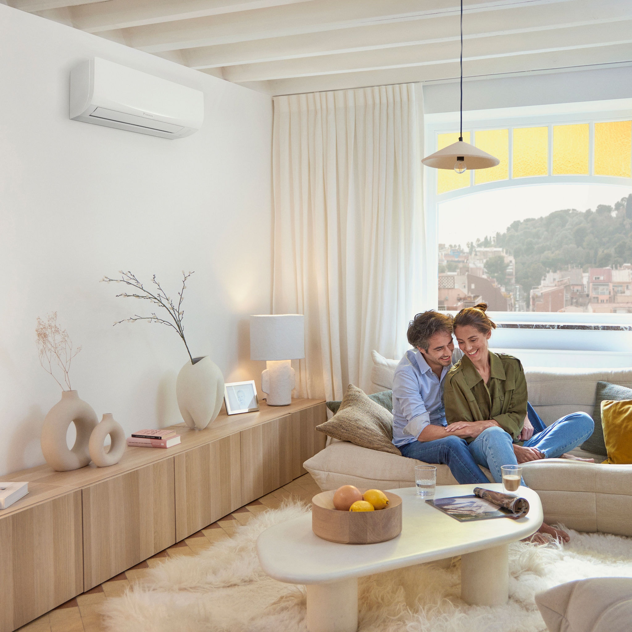 A couple sitting in a cosy couch