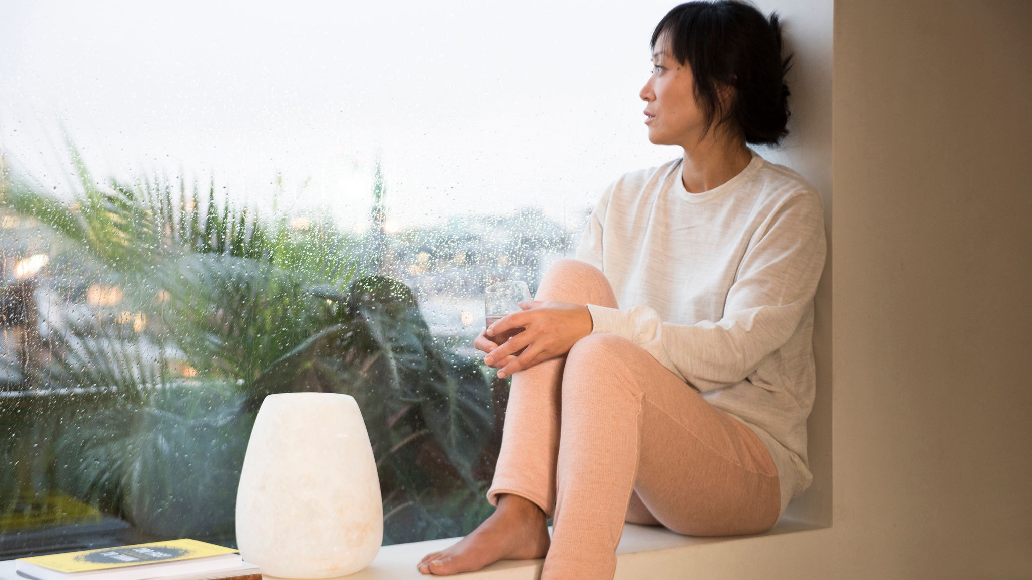 Woman enjoying her cosy perfect room temperature
